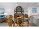 Coastal-themed dining area with glass-top table and four chairs at 1351 Pelican Watch Villas, Seabrook Island, SC 29455
