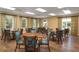Bright dining room with multiple tables and chairs at 1351 Pelican Watch Villas, Seabrook Island, SC 29455