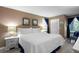 Main bedroom with a comfortable king-size bed, and a view to a sitting area at 1351 Pelican Watch Villas, Seabrook Island, SC 29455