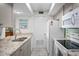 Kitchen features granite countertops, stainless steel appliances, and light-colored cabinets at 1351 Pelican Watch Villas, Seabrook Island, SC 29455