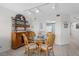 Dining area with glass-top table and four chairs, adjacent to kitchen at 1351 Pelican Watch Villas, Seabrook Island, SC 29455