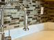 Close-up of modern chrome kitchen faucet with a high-neck design at 14 Lockwood Dr # 11A, Charleston, SC 29401