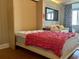 Murphy bed with pink cover and wooden frame at 14 Lockwood Dr # 11A, Charleston, SC 29401