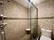 Shower with tiled walls and built-in shelving at 14 Lockwood Dr # 11A, Charleston, SC 29401