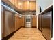 Modern kitchen with stainless steel appliances and wood cabinets at 14 Lockwood Dr # 11A, Charleston, SC 29401