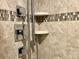 Close up of shower with tiled walls and shelves at 14 Lockwood Dr # 11A, Charleston, SC 29401