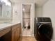 Bathroom with shower, toilet, vanity, and washer at 14 Lockwood Dr # 11A, Charleston, SC 29401