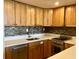 Modern kitchen with light wood cabinets and mosaic backsplash at 14 Lockwood Dr # 11A, Charleston, SC 29401