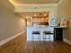 Modern kitchen features a breakfast bar, wood cabinets, and wine cooler at 14 Lockwood Dr # 11A, Charleston, SC 29401