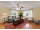 Living room with hardwood floors, ceiling fan, and comfortable seating at 1121 Heaven Dr, Saint Stephen, SC 29479