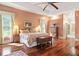 Large bedroom with hardwood floors and ensuite bathroom access at 6036 Postell Dr, Ravenel, SC 29470