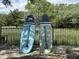 Two paddleboards leaning against a fence near the water at 1010 E Erie Ave, Folly Beach, SC 29439