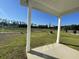 Covered patio overlooking a backyard with pond views at 840 Descartes St, Summerville, SC 29486