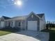 Craftsman style home with gray and beige exterior, white garage door, and landscaping at 840 Descartes St, Summerville, SC 29486