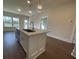 Island kitchen with stainless steel sink and modern lighting fixtures at 840 Descartes St, Summerville, SC 29486