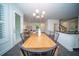 Light-filled dining area with wooden table and black chairs at 338 Long Pier St, Summerville, SC 29486