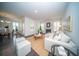 Open living room and kitchen with a large sectional sofa and fireplace at 338 Long Pier St, Summerville, SC 29486