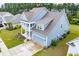 Two-story home with gray roof, light blue siding, and a two-car garage at 338 Long Pier St, Summerville, SC 29486