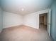Bright bedroom with neutral carpet, one window, and access to hallway at 338 Long Pier St, Summerville, SC 29486