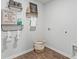 Laundry room with stylish shelving and a large laundry basket at 630 Sweet Ramble Way, Summerville, SC 29486