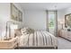 Bedroom with a white bed and patterned bedding at 630 Sweet Ramble Way, Summerville, SC 29486