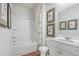 Bright bathroom featuring a tub/shower, white vanity, and wood-look floors at 630 Sweet Ramble Way, Summerville, SC 29486