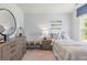 Bedroom with dresser, nightstand, and striped bedding at 630 Sweet Ramble Way, Summerville, SC 29486