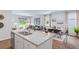 Open kitchen boasts granite countertops and stainless steel appliances at 630 Sweet Ramble Way, Summerville, SC 29486
