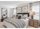 Main bedroom with king bed, plush carpet, and stylish decor at 630 Sweet Ramble Way, Summerville, SC 29486