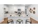 Modern kitchen with white cabinets, granite countertops, and island with seating at 630 Sweet Ramble Way, Summerville, SC 29486
