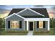 Charming one-story home with gray siding, white trim, and a welcoming porch at 168 River Hill Rd, Goose Creek, SC 29445