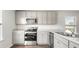 Modern kitchen with gray cabinets and appliances at 168 River Hill Rd, Goose Creek, SC 29445