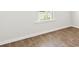 Simple bedroom with wood-look flooring and large window at 168 River Hill Rd, Goose Creek, SC 29445
