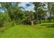 Playset in a spacious backyard with lush grass at 1227 River Rd, Johns Island, SC 29455