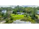 Aerial view of house with large backyard and marsh views at 1227 River Rd, Johns Island, SC 29455