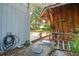 Side yard with wooden structures, patio and walkway at 412 E Hudson Ave, Folly Beach, SC 29439