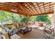 Covered deck with seating and a view of the backyard at 412 E Hudson Ave, Folly Beach, SC 29439