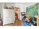 Storage room with a white wardrobe and colorful artwork at 412 E Hudson Ave, Folly Beach, SC 29439