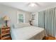 Bedroom with queen bed, hardwood floors, and ceiling fan at 412 E Hudson Ave, Folly Beach, SC 29439