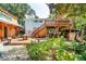 Large backyard with multiple decks, a guest house and lush greenery at 412 E Hudson Ave, Folly Beach, SC 29439
