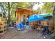 Wooden workshop with a blue beach umbrella and various tools at 412 E Hudson Ave, Folly Beach, SC 29439
