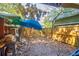 Small backyard with gravel ground, wooden fence, and storage shed at 412 E Hudson Ave, Folly Beach, SC 29439