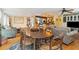 Dining area with oval wood table and comfortable seating at 412 E Hudson Ave, Folly Beach, SC 29439
