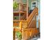 Elevated wooden deck with stairs leading to ground level at 412 E Hudson Ave, Folly Beach, SC 29439