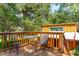 Wooden deck with small table and chairs, offering a relaxing outdoor space at 412 E Hudson Ave, Folly Beach, SC 29439