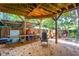 Covered deck with wooden ceiling, and climbing wall feature at 412 E Hudson Ave, Folly Beach, SC 29439
