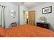 Bedroom with queen bed, dresser, and access to another room at 412 E Hudson Ave, Folly Beach, SC 29439