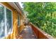 Wooden deck overlooking lush greenery, offering outdoor relaxation at 412 E Hudson Ave, Folly Beach, SC 29439