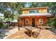 Charming wooden guest house with deck and artistic features at 412 E Hudson Ave, Folly Beach, SC 29439