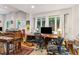 Bright home office with a large desk, comfortable chairs, and natural light at 412 E Hudson Ave, Folly Beach, SC 29439